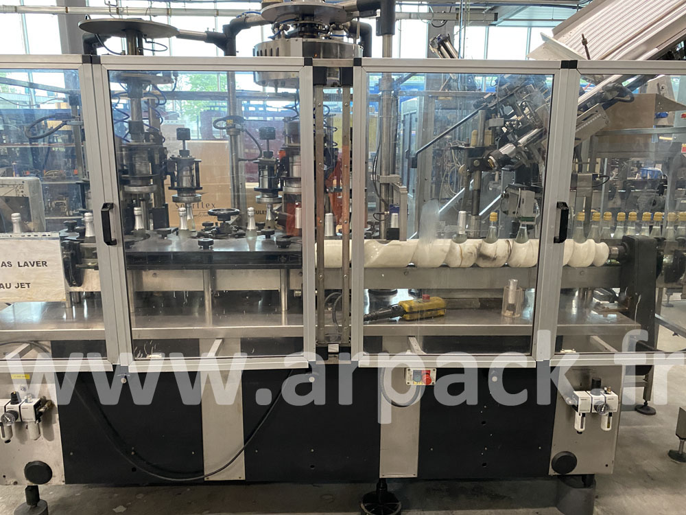 Machine de distribution et de sertissage de coiffes champagne 